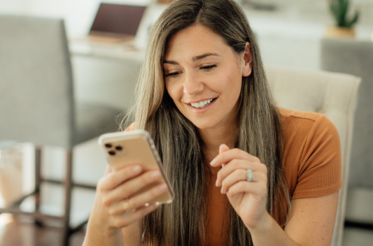 women looking at mobile phone