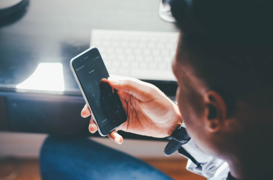 man looking at mobile phone